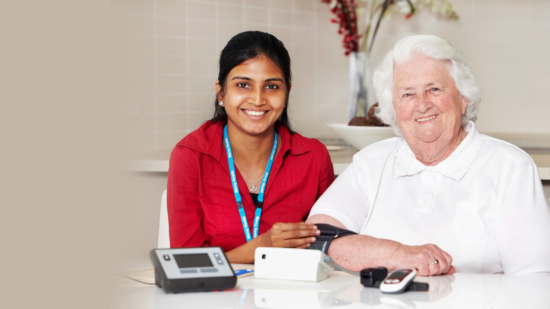 mercy health worker with elderly woman